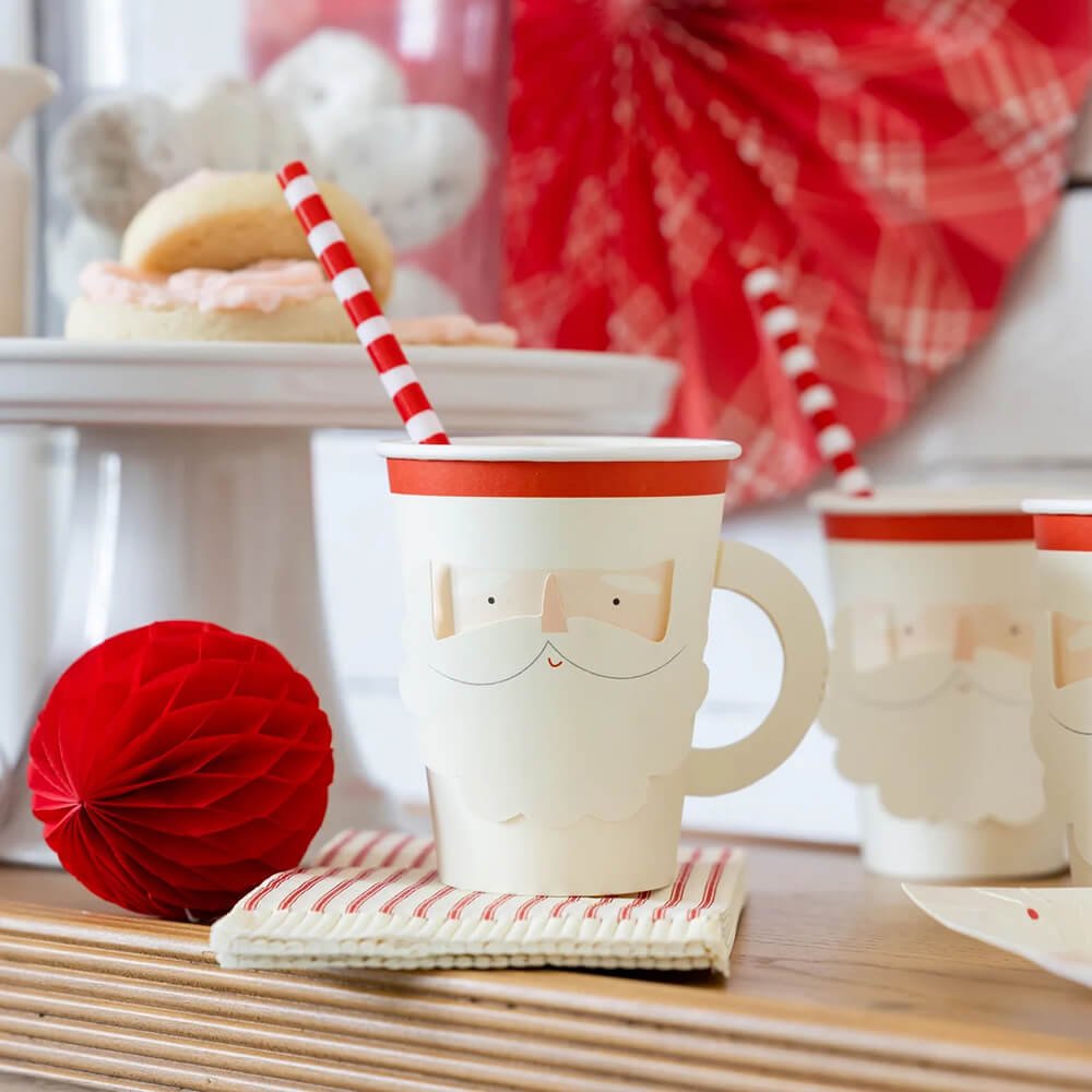 https://cdn.shopify.com/s/files/1/0548/9763/9597/files/believe-christmas-santa-face-paper-party-cup-with-handle-styled_1024x1024.jpg?v=1700285044