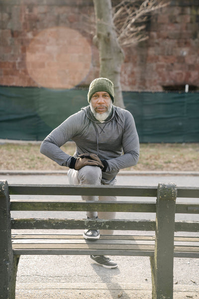 Black Man With Gray Beard Lunging On Bench