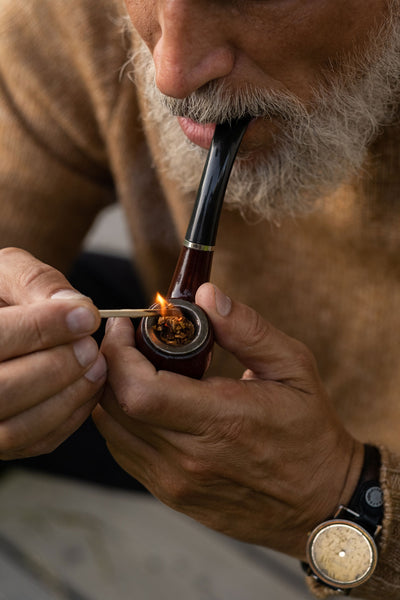 Man With Gray Beard Smoking Pipe