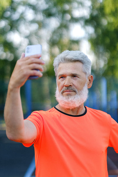 Man With Salt Pepper Hair Taking A Selfie