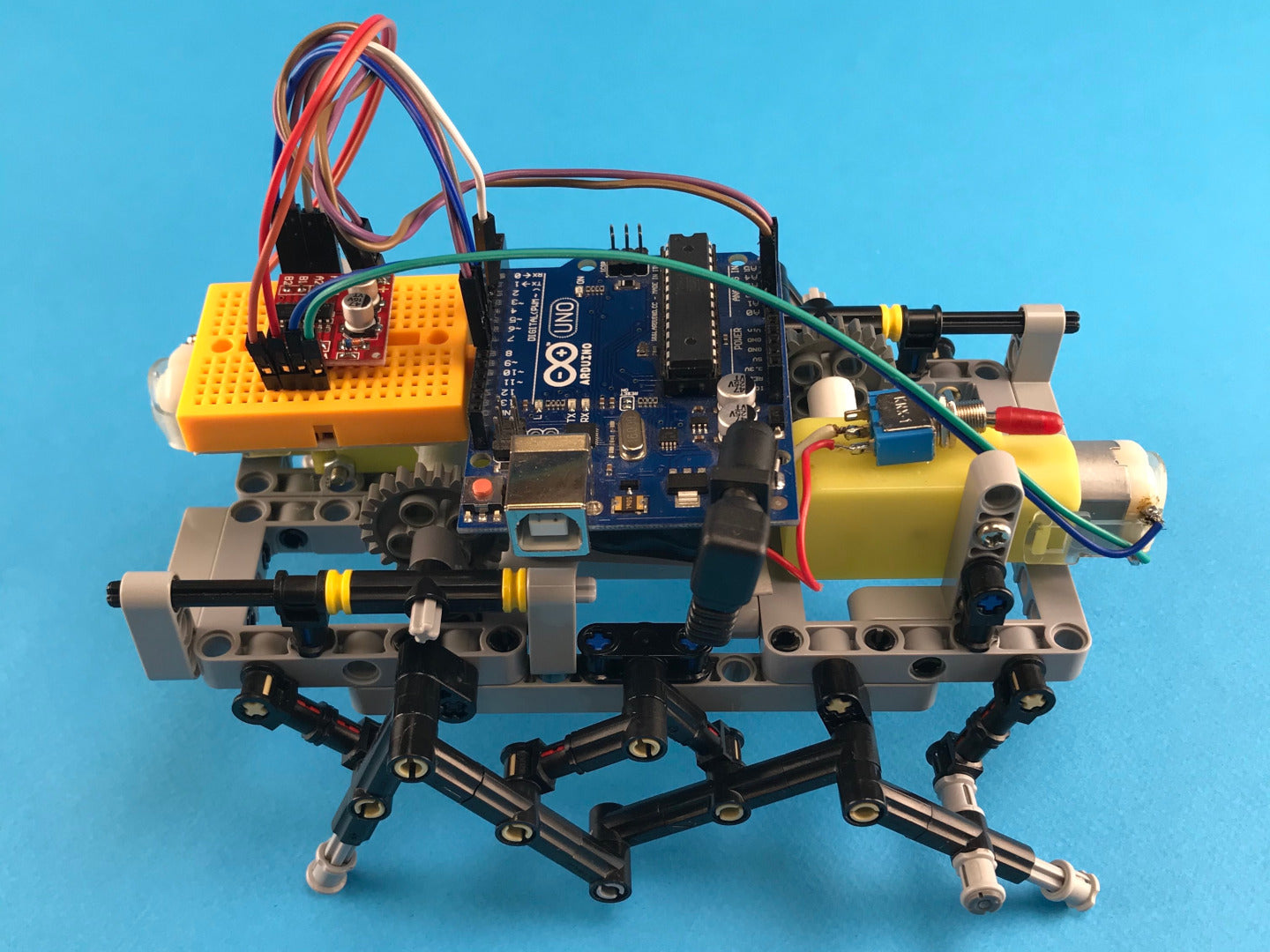 You can create a Hexapod robot with two DC motor and LEGO®-compatible blocks with your kids.