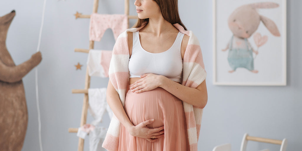 Pregnant lady in nursery room