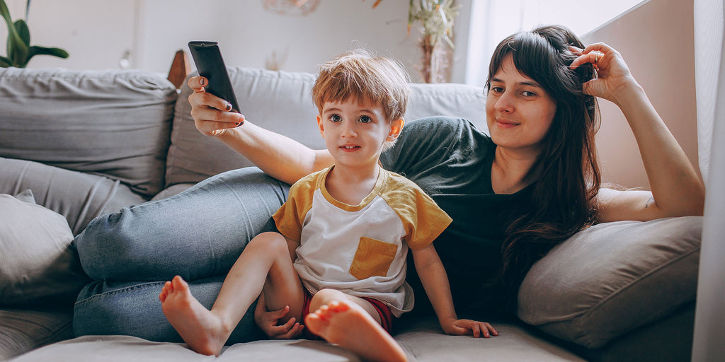 Mother and son watching TV together