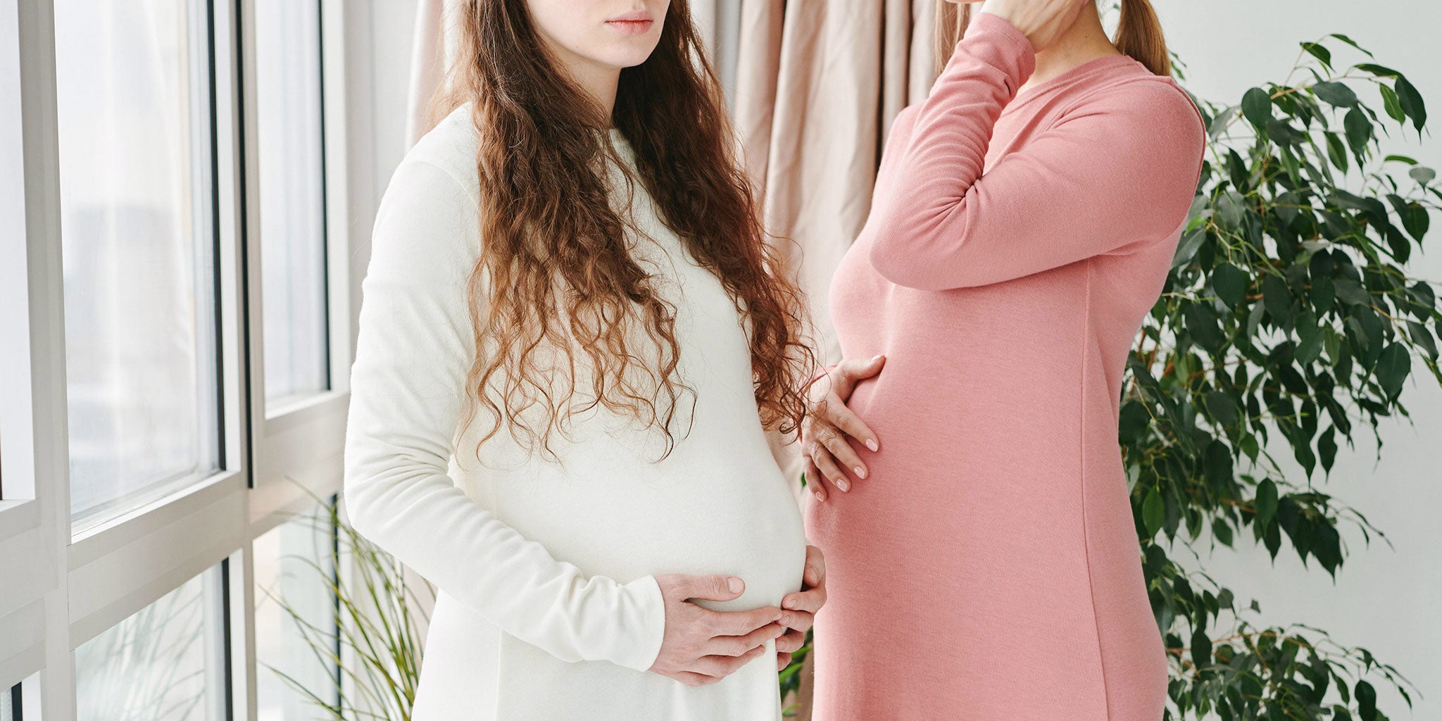 Pregnant women wearing neutral clothing