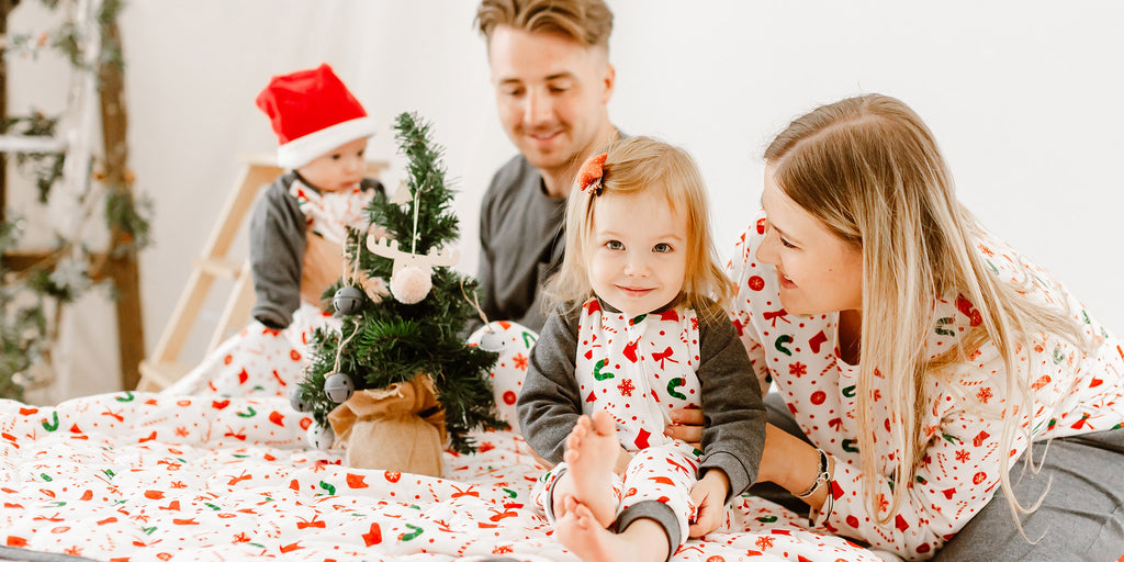 Family wearing holiday themed pajamas