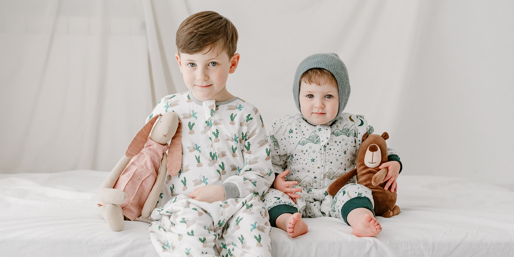 Toddler and baby wearing Nest Designs sleepwear