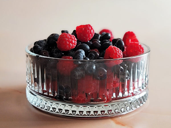 fluted glass bowl with berries