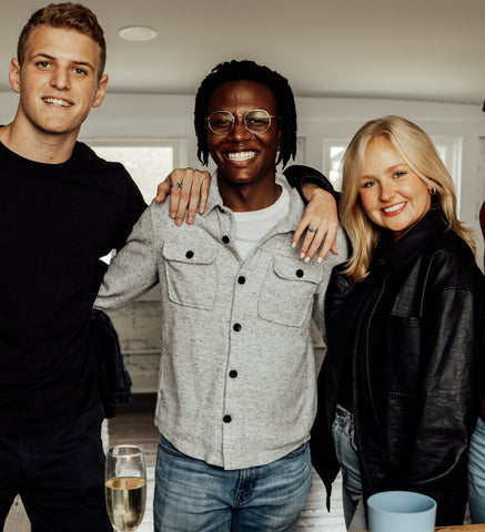 Three friends wearing silver fidget rings