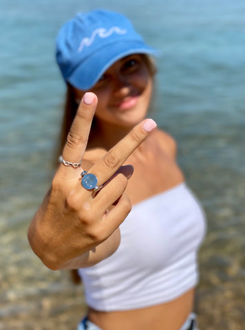 Person at the beach wearing fidget jewelry