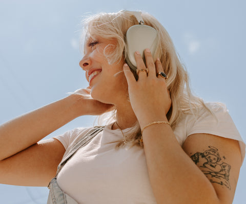 Person listening to music wearing fidget rings