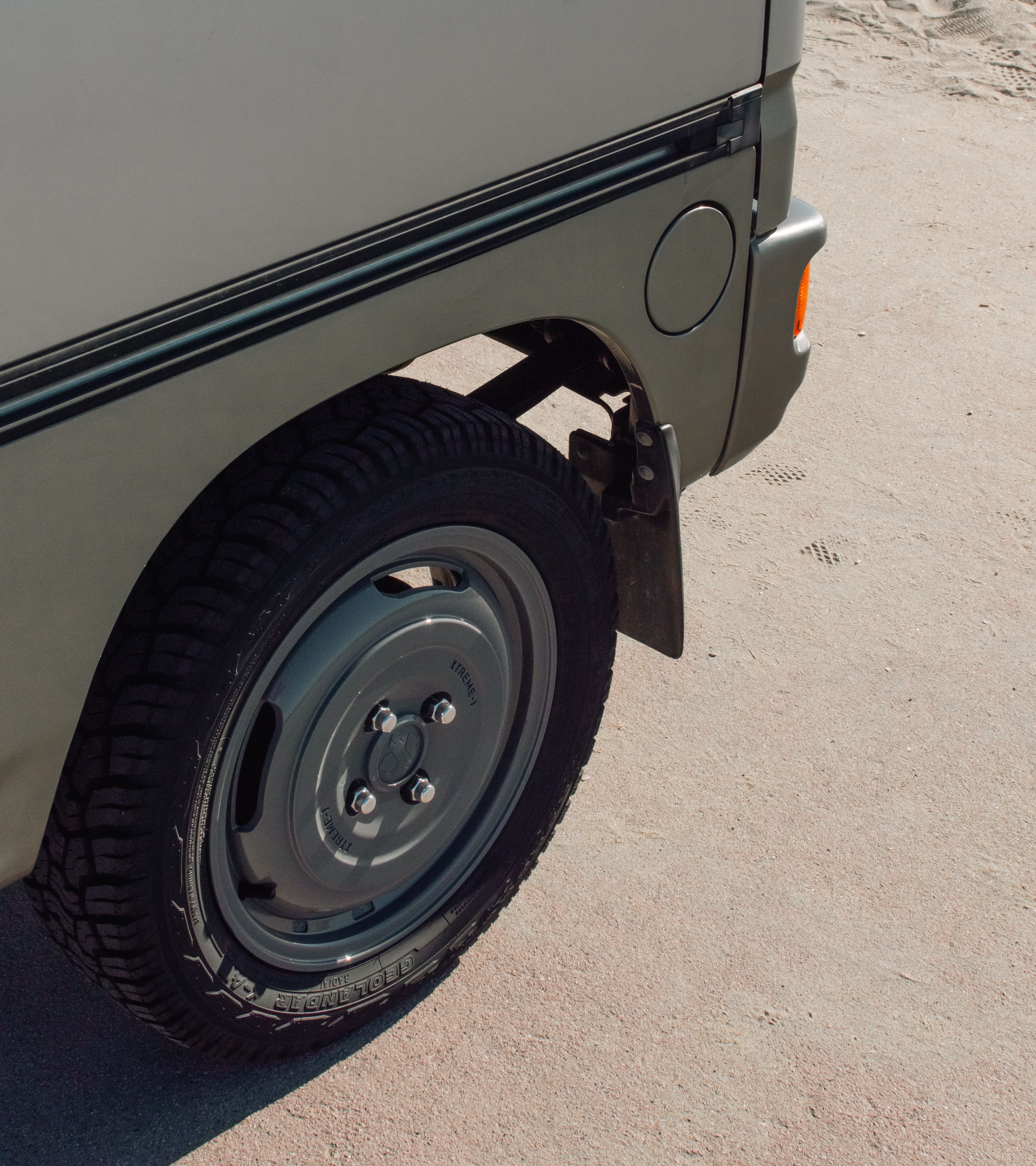 Close-up of Honda Acty Van wheel featuring robust steel rim and Yokohama tire, providing reliable performance for daily driving.