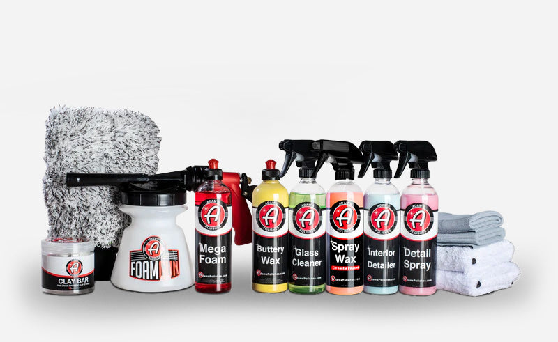 Adam’s Polishes best car detailing products kit featuring Mega Foam, Buttery Wax, Spray Wax, Glass Cleaner, Interior Detailer, Detail Spray, clay bar, foam sprayer, and plush microfiber towels for professional car care.