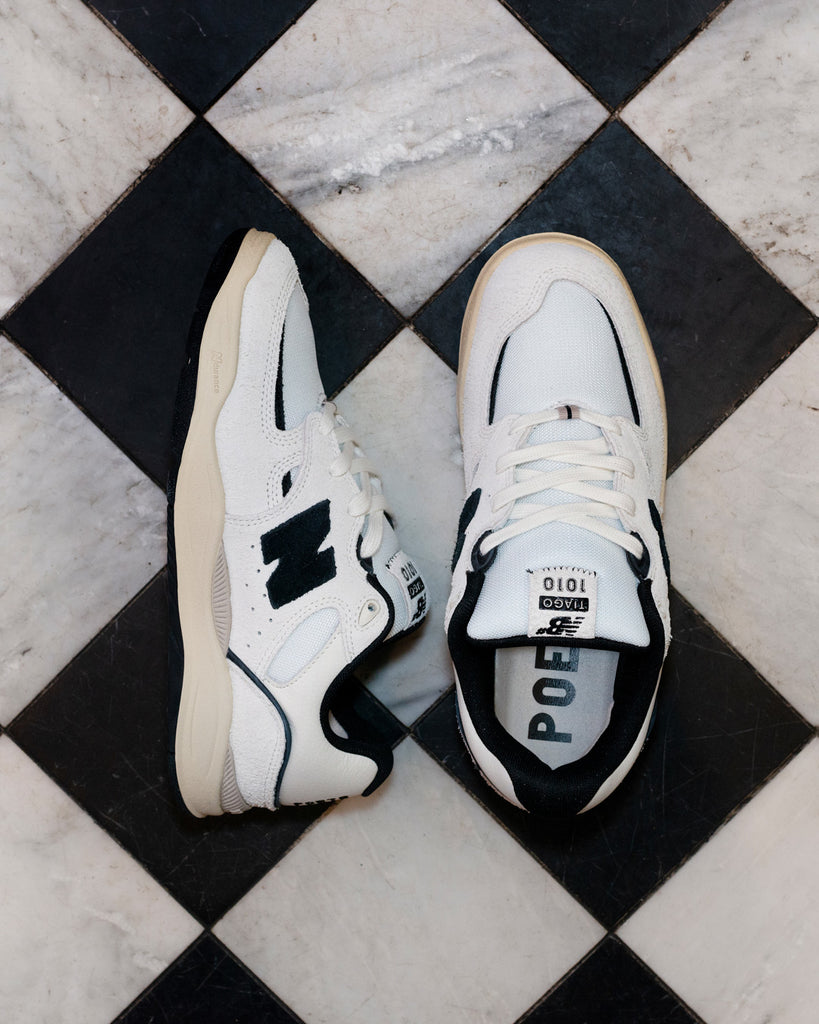 New Balance 1010 x Poets Brand on black and white tiled floor