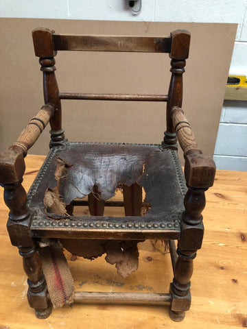 Before photograph of customers damaged childs chair which arrived in the workshop toreupholstered