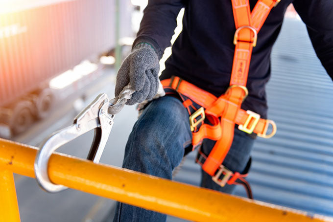 a construction worker wearing a safety harness