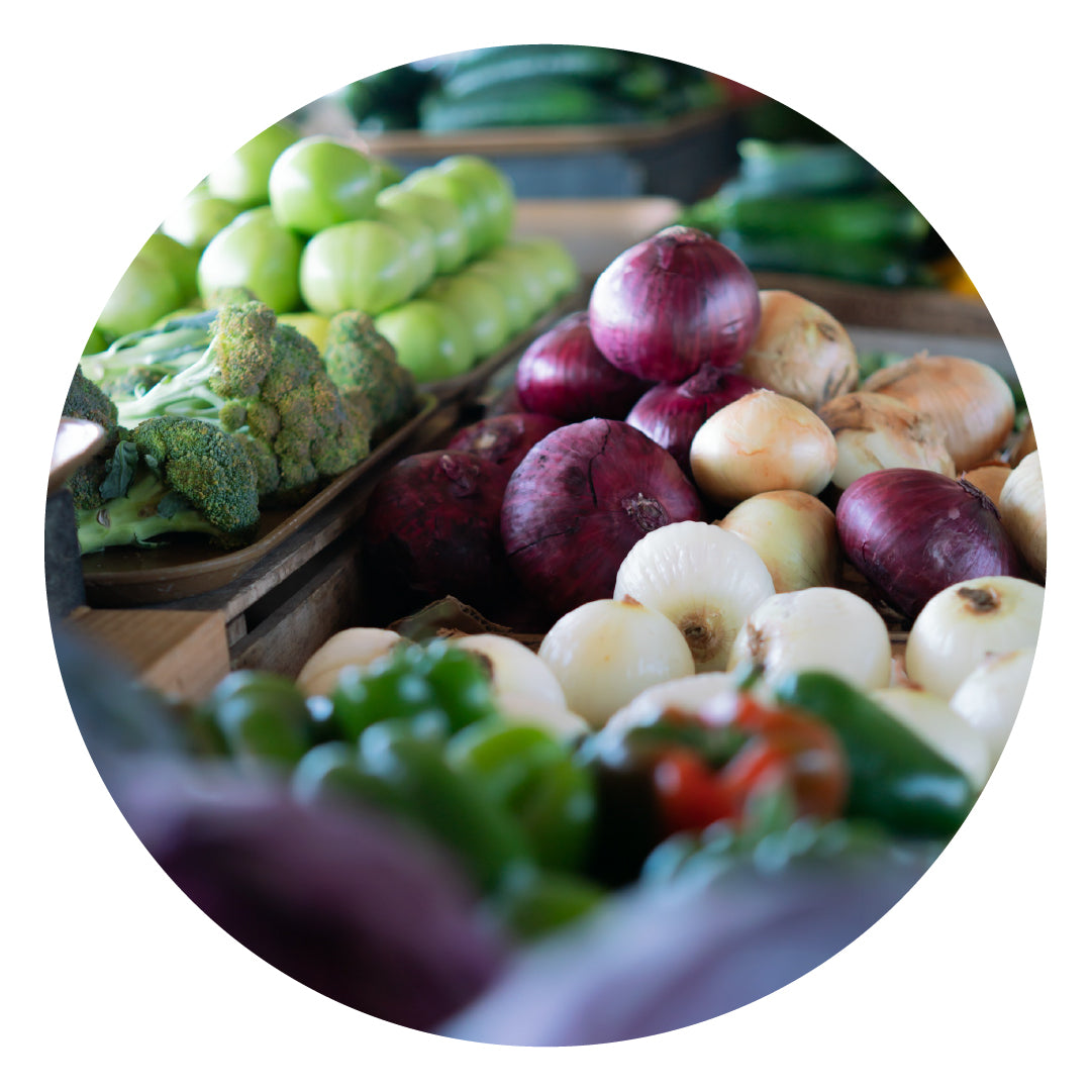 Rainbow array of fresh produce at a farmers market