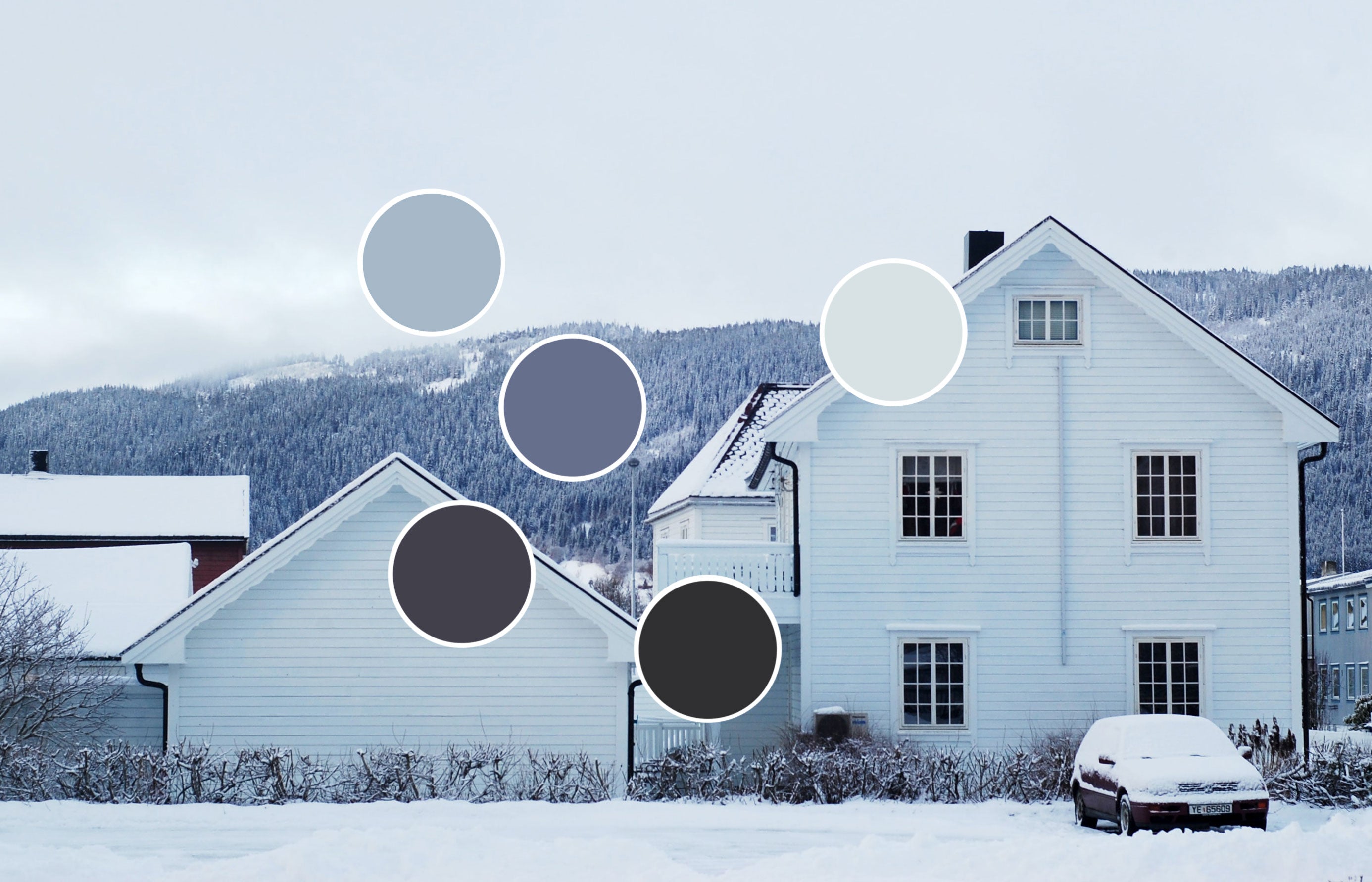 White house in wintry landscape/Photography: Adrianna Kaczmarek/A quaint scene in Orkanger, Norway, inspires a paint palette of cool whites, blues, and blacks.