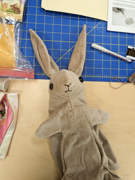 The bunny getting sewn together and stuffed!