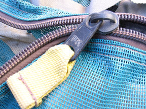 Photo of a used Solgear bag with a PK zipper blown out