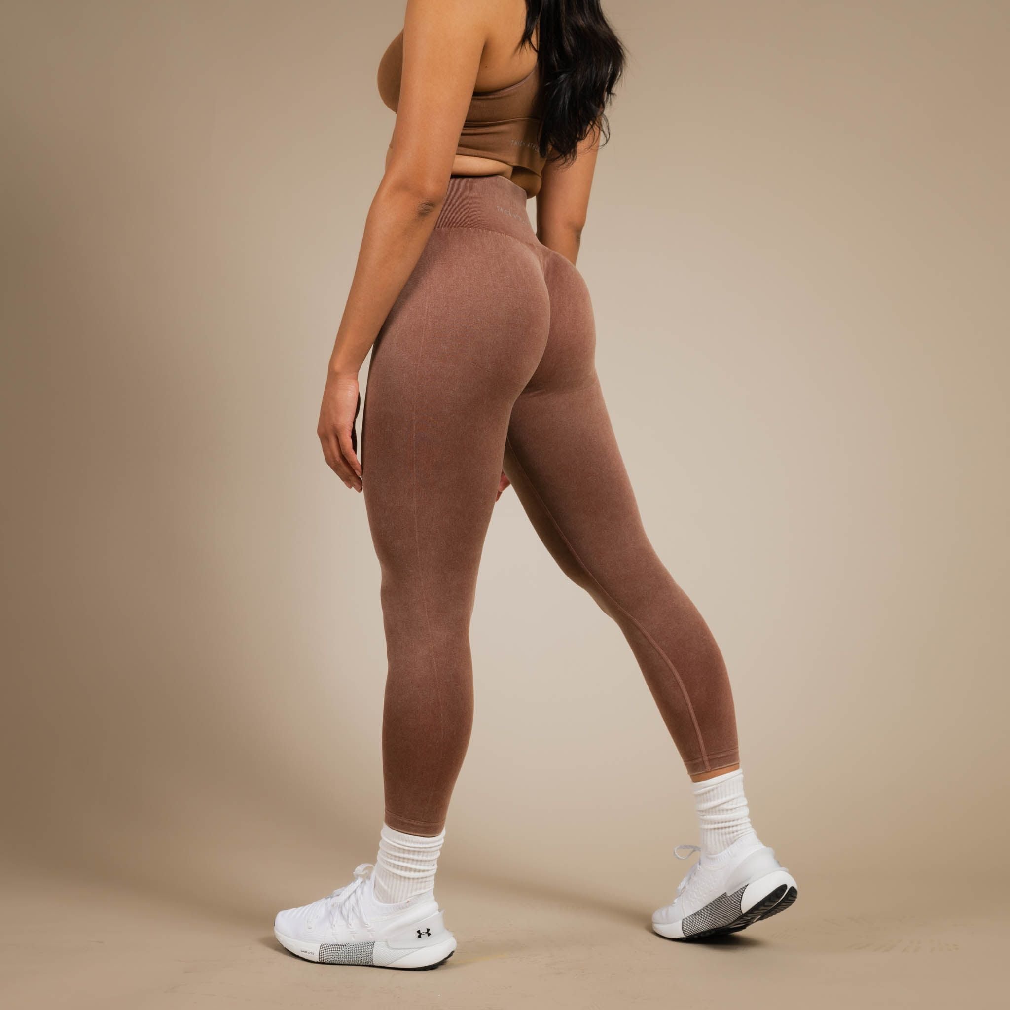 Model wearing brown leggings