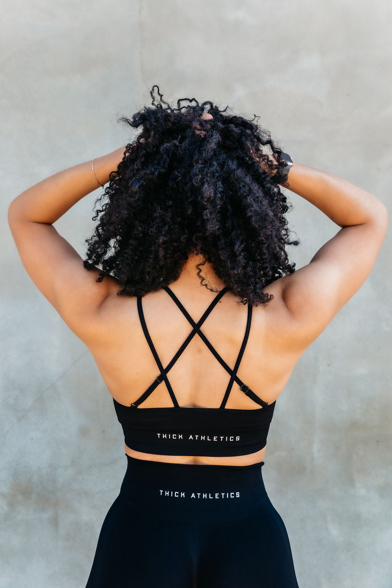 Model wearing black sports bra