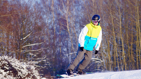 Carving on a snowboard.