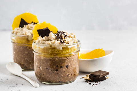 chocolate oats in jars with fruit toppings