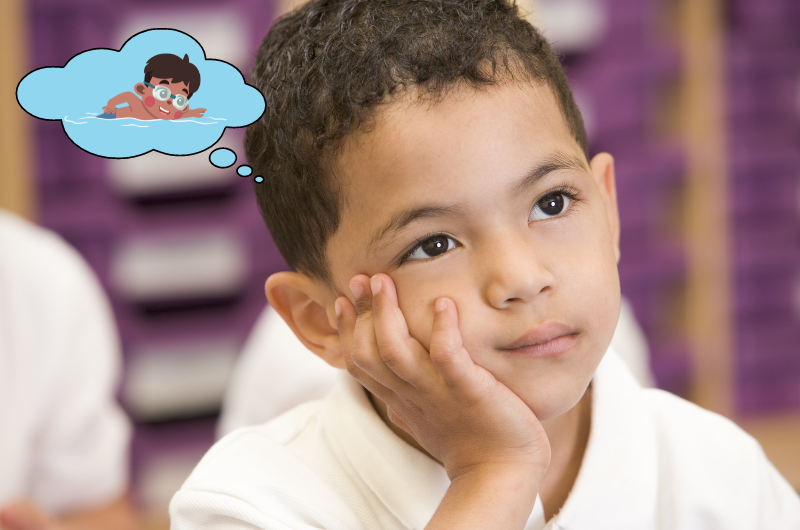 young boy with his head leaning into his hand daydreaming about swimming a graphic illustration of a thought bubble with a boy swimming next to his head