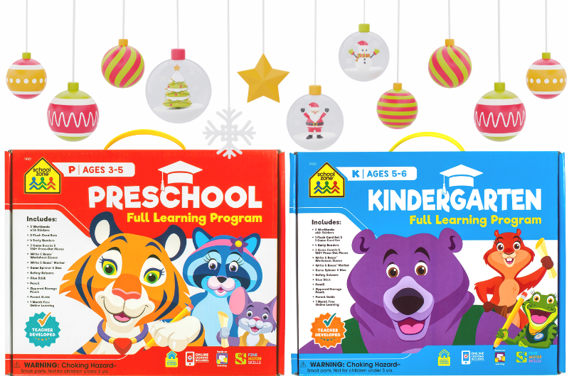 preschool and kindergarten full learning programs from school zone with Christmas ornaments dangling above the boxes