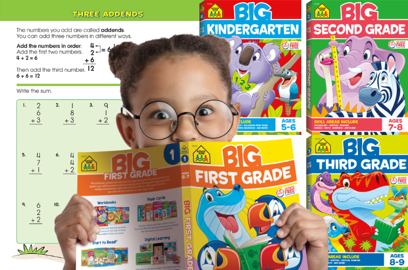 girl in glasses holding up a School Zone first grade workbook with kindergarten, second grade and third grade School Zone big workbooks to the left of her