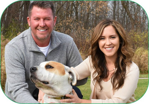 The family who founded Balanced Breed pose for a family photo with their rescue dog, George