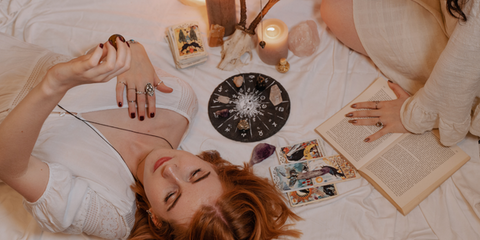 woman laying down with crystals