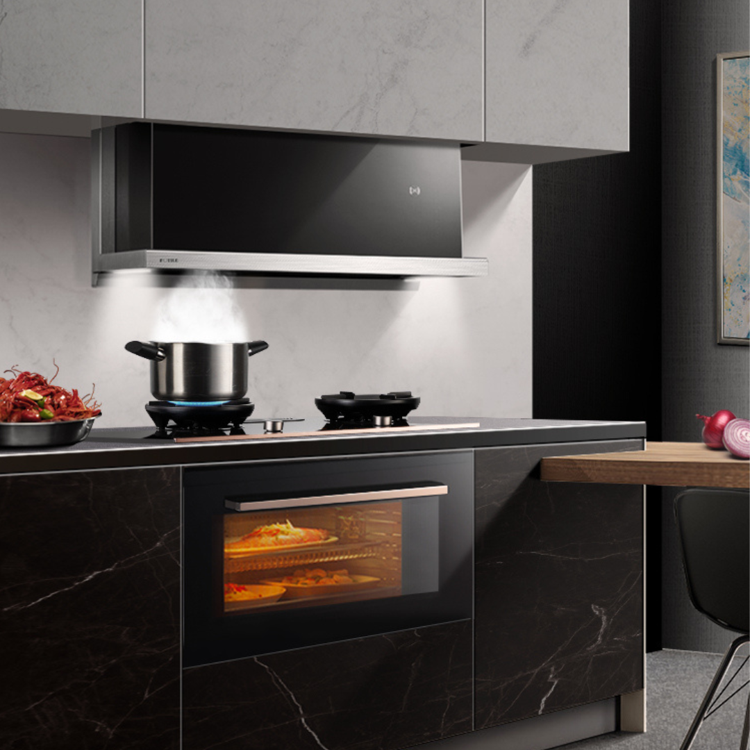 Black FOTILE range hood absorbing steam from a pot on a cooktop in a modern kitchen.