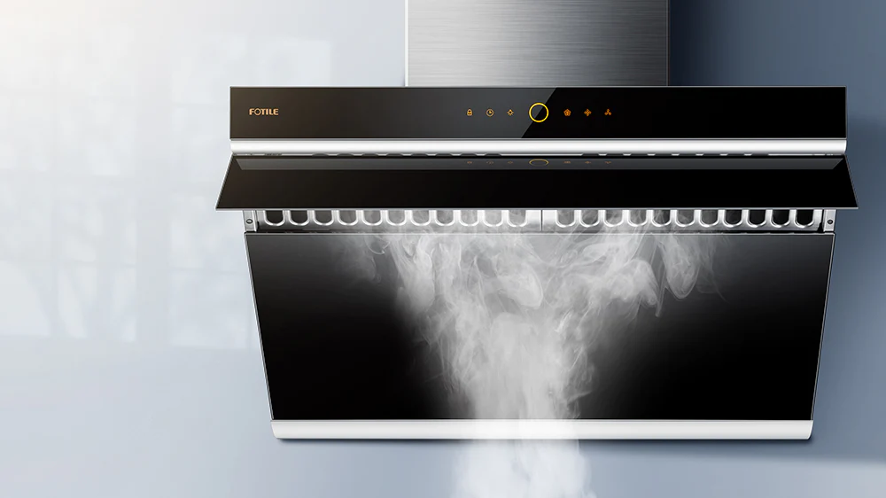 Black under-cabinet range hood absorbing steam from a pot