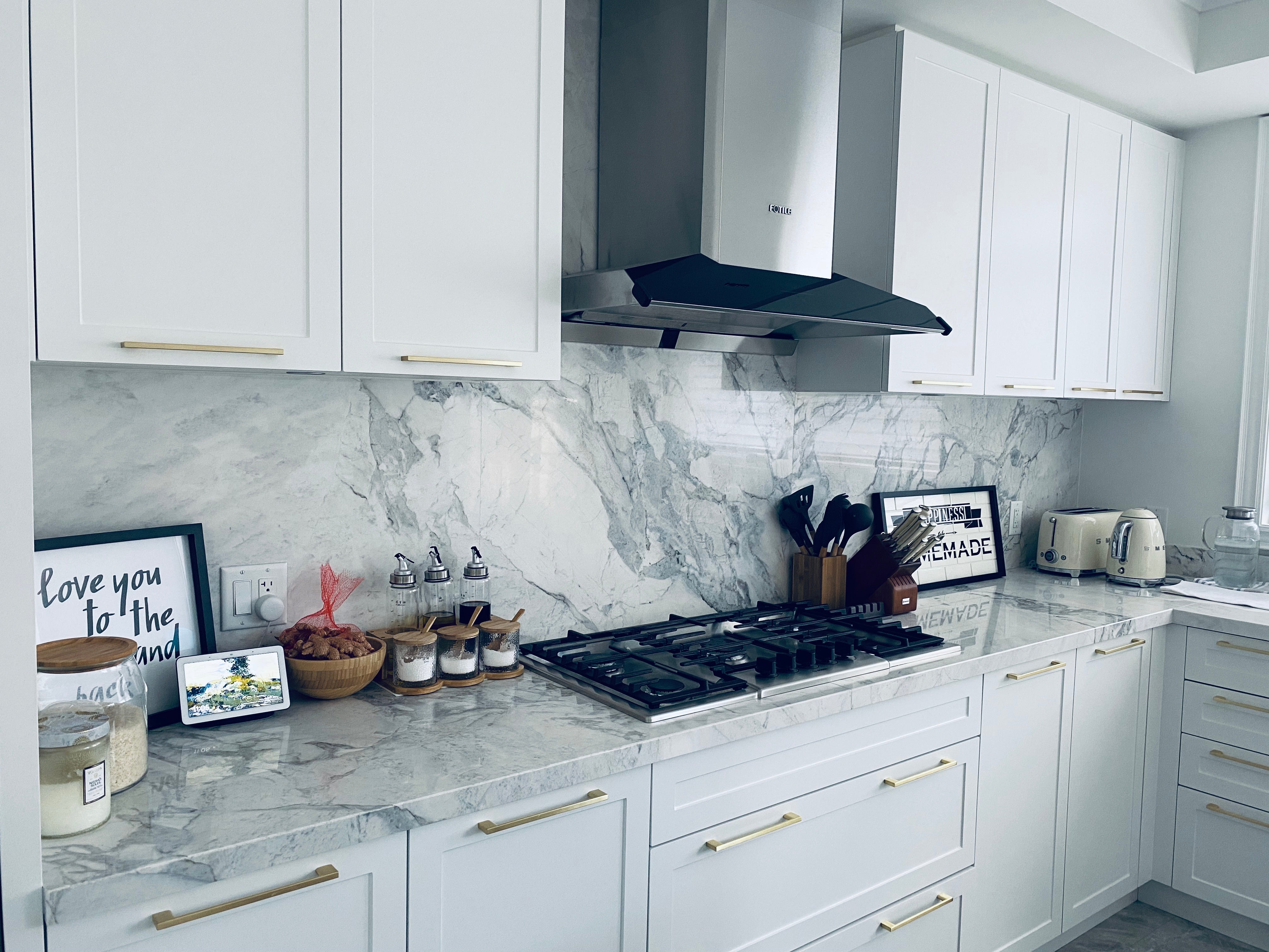 EMG9030 Range Hood installed in a white kitchen