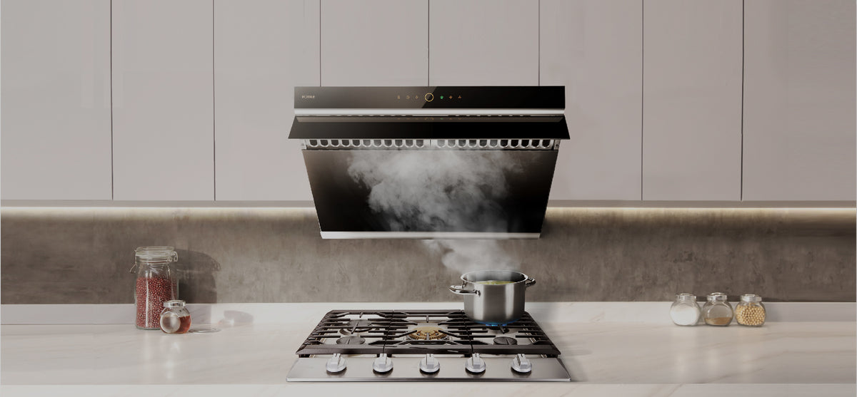 FOTILE range hood absorbing smoke from a pan cooking on a gas cooktop