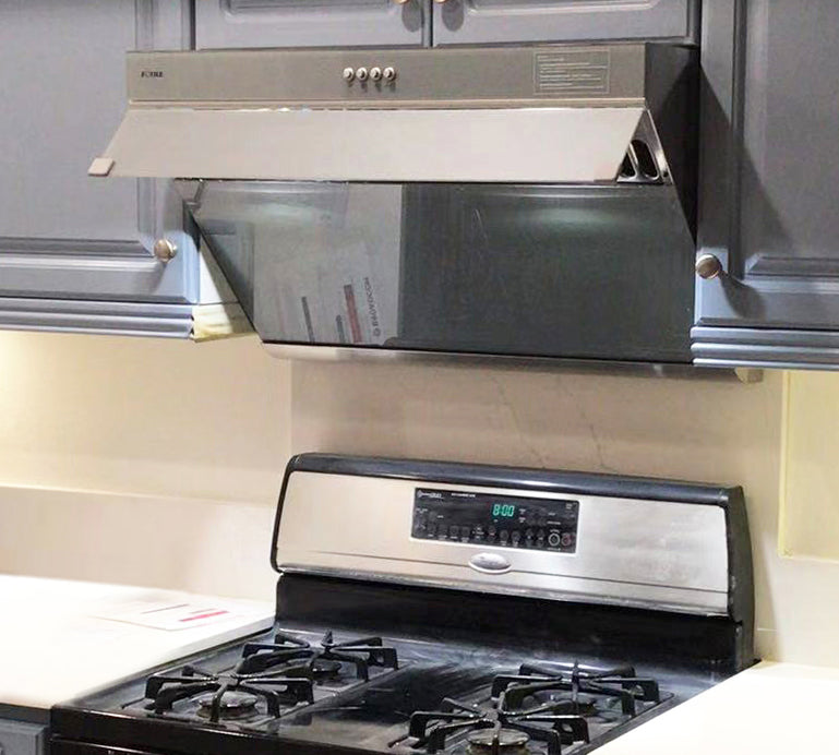 Silver gray JQG02 Series range hood above a black stove.