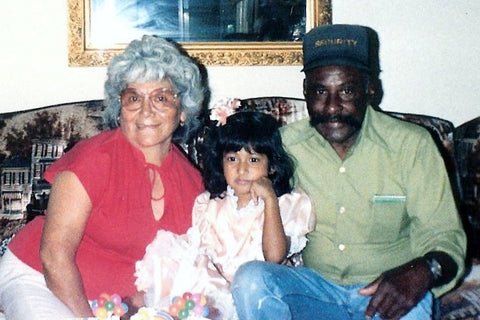 Piñata maker, Amorette, at 4 or 5 years old, posing with elders on her birthday. 