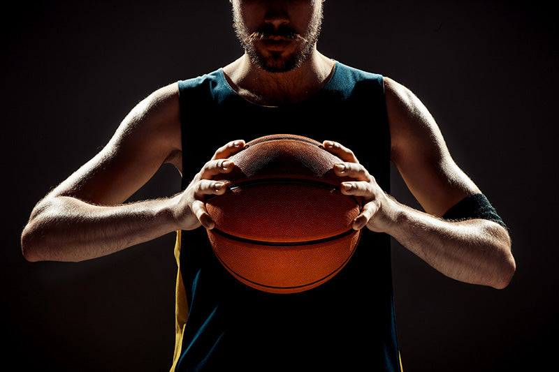 silhouette-view-basketball-player-holding-basket-ball-black-space