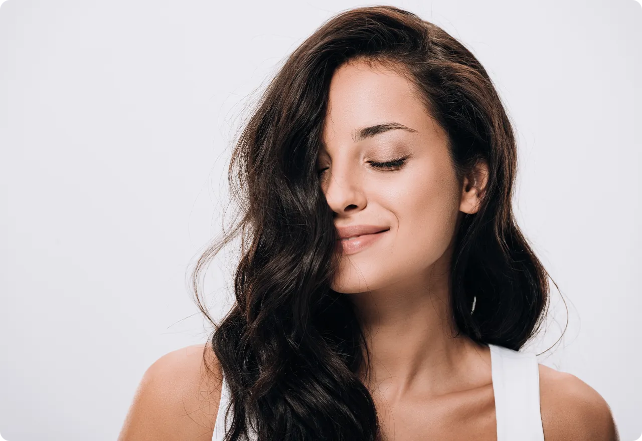 a women smelling her hair