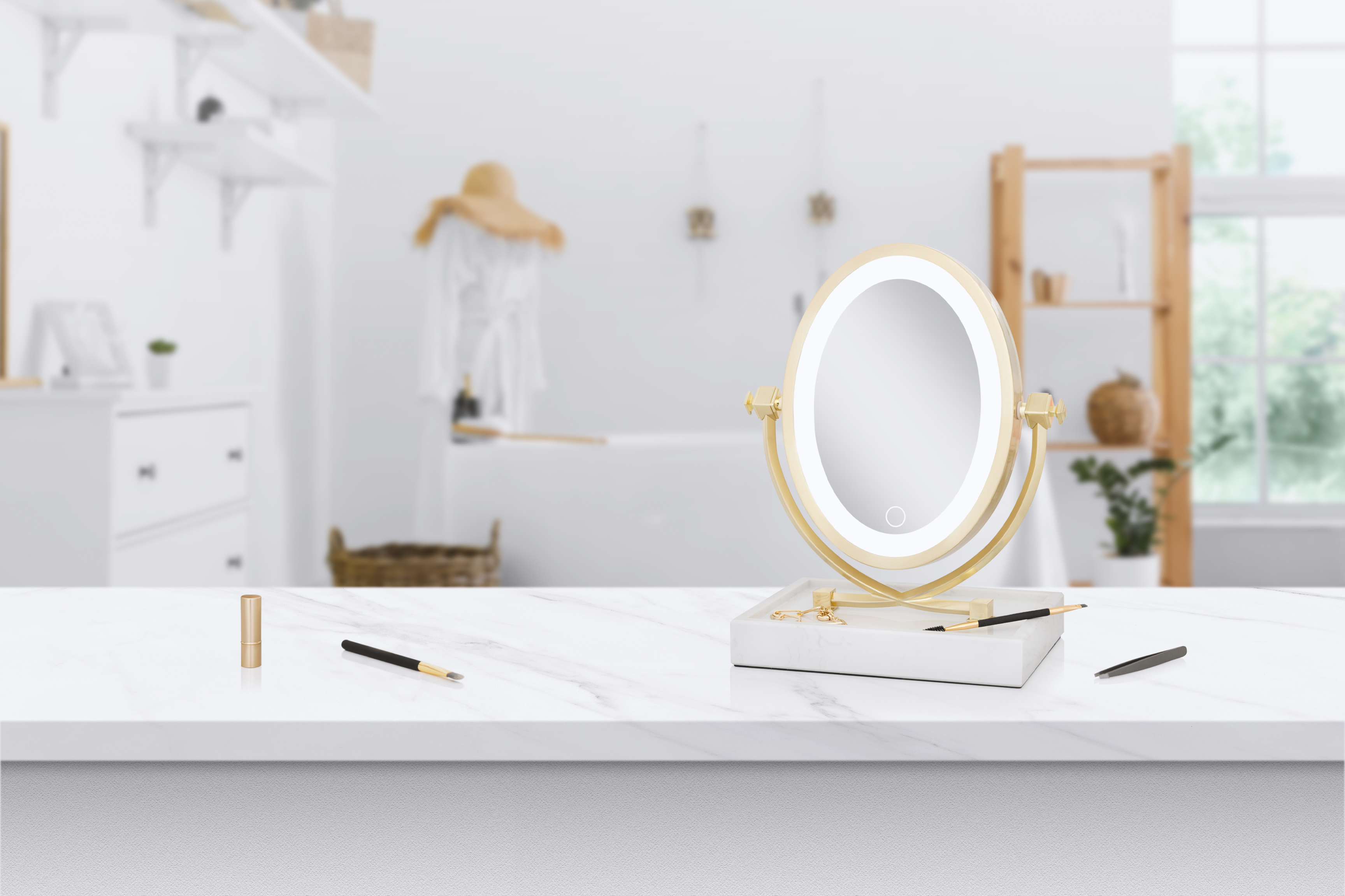 Zadro Brooklyn LED lighted vanity mirror, true marble base with organizing tray. satin gold makeup face mirror next to cosmetics on top of a white marble bathroom countertop surrounded by a white washed room with natural wood accents