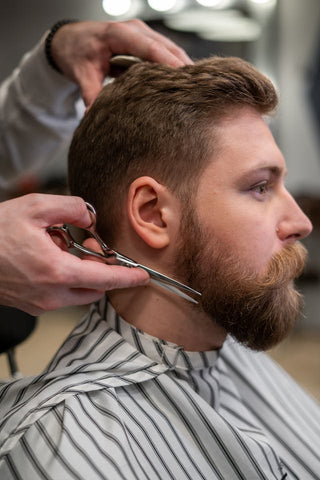 Healthy beard being trimmed