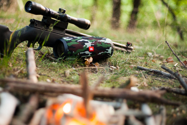 hunter using airgun in the woods