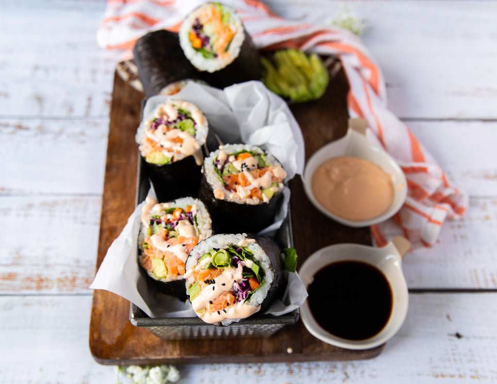 Photo of a sushi burrito wrapped in seaweed