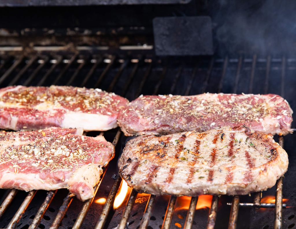 Ribeye steaks on the grill