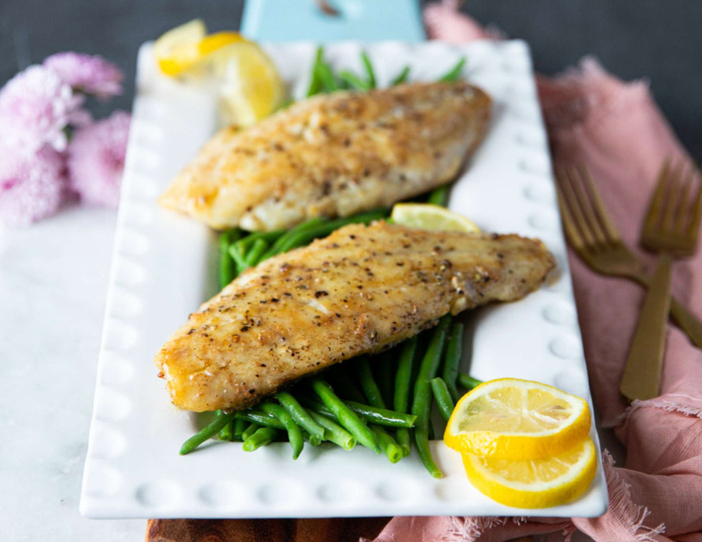 Sealand snapper fillets with green beans and lemon slices