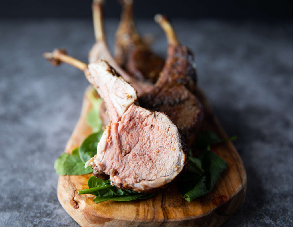 French cut rack of lamb on cutting board