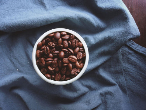 Cup of whole bean coffee 