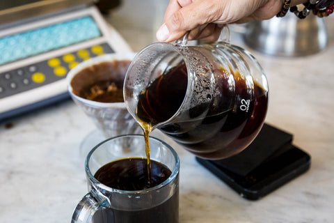 pouring a fresh brewed coffee from hario v60