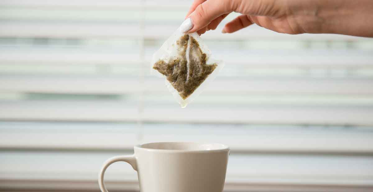 Women take the used tea sachets